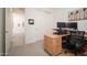 Inviting home office with modern desk setup featuring dual monitors and ample workspace at 24127 N 166Th Ct, Surprise, AZ 85387