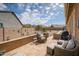 Inviting patio with comfortable seating, offering a relaxing outdoor space overlooking the landscaped backyard at 24127 N 166Th Ct, Surprise, AZ 85387