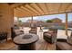 Inviting patio with a gas fire pit and comfortable seating at 24127 N 166Th Ct, Surprise, AZ 85387