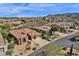 Stunning aerial view of a home with desert landscaping, tile roof, and mountain views at 26521 N 114Th Pl, Scottsdale, AZ 85255