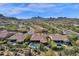 Beautiful aerial shot of an upscale desert community featuring homes with pools and scenic mountain vistas at 26521 N 114Th Pl, Scottsdale, AZ 85255