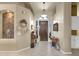 Entry foyer with decorative niche and furnishings, tiled floor and high ceilings at 26521 N 114Th Pl, Scottsdale, AZ 85255