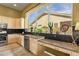 Kitchen features granite countertops and abundant natural light from a large window at 26521 N 114Th Pl, Scottsdale, AZ 85255