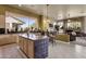 Open kitchen with center island, granite countertops, and stainless steel appliances at 26521 N 114Th Pl, Scottsdale, AZ 85255