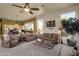 Cozy living room with comfortable seating and views into the kitchen at 26521 N 114Th Pl, Scottsdale, AZ 85255