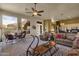 Living room with large windows providing abundant natural light and views at 26521 N 114Th Pl, Scottsdale, AZ 85255