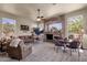 Inviting living room featuring a stone fireplace and plush seating at 26521 N 114Th Pl, Scottsdale, AZ 85255