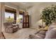 Living room with neutral colors, carpet flooring, comfortable seating and plenty of natural light at 26521 N 114Th Pl, Scottsdale, AZ 85255