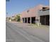 Townhome featuring covered parking spaces beneath the building and an adjacent street at 2666 N 43Rd Ave # C, Phoenix, AZ 85009