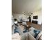 Bright living room featuring hardwood floors, modern furniture, and a dining area at 2666 N 43Rd Ave # C, Phoenix, AZ 85009