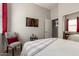 Comfortable bedroom featuring a chair, abstract art, and sliding mirrored closet doors with ample natural light at 27315 N 83Rd Dr, Peoria, AZ 85383