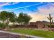 Stunning community entrance sign for West Wing Mountain, framed by lush landscaping and a picturesque mountain backdrop at 27315 N 83Rd Dr, Peoria, AZ 85383