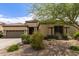 Charming single-story home with desert landscaping and a two-car garage in a sunny neighborhood at 27315 N 83Rd Dr, Peoria, AZ 85383