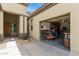 View of the two-car garage with open door showing the interior workshop and tools at 27315 N 83Rd Dr, Peoria, AZ 85383