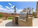 Built-in outdoor grill and counter area perfect for entertaining in a beautiful outdoor setting at 27315 N 83Rd Dr, Peoria, AZ 85383