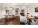 Open-concept living and dining areas with wood floors, archways, and stylish furniture at 27315 N 83Rd Dr, Peoria, AZ 85383