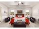 Main bedroom with a bed, tray ceiling, and seating areas, offering a relaxing retreat at 27315 N 83Rd Dr, Peoria, AZ 85383