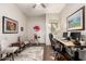 Bright office space featuring dual monitors, a rolling chair, and artful decor for a productive environment at 27315 N 83Rd Dr, Peoria, AZ 85383