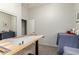 Versatile office space with adjustable height desk, neutral walls, and natural light suitable for a home office at 27315 N 83Rd Dr, Peoria, AZ 85383