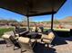 Comfortable outdoor lounge area with plush seating under a covered patio, providing a relaxing space for community residents at 27315 N 83Rd Dr, Peoria, AZ 85383