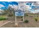 Westwing Park sign surrounded by desert vegetation, showcasing the community's recreational space at 27315 N 83Rd Dr, Peoria, AZ 85383