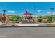 WestWing Park entrance with a playground featuring shade structures and play equipment at 27315 N 83Rd Dr, Peoria, AZ 85383