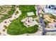 Aerial view showcasing a playground, picnic area, park, and parking lot in the community at 28071 N Superior Rd, San Tan Valley, AZ 85143