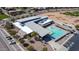 Aerial view of the community pool, clubhouse, parking lot, and surrounding neighborhood at 28071 N Superior Rd, San Tan Valley, AZ 85143