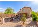 Large backyard featuring desert landscaping, a covered patio, and serene outdoor space at 28071 N Superior Rd, San Tan Valley, AZ 85143