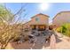 Desert landscaping in the backyard, featuring a covered patio, and serene outdoor space at 28071 N Superior Rd, San Tan Valley, AZ 85143