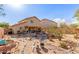 Expansive backyard showcasing desert landscaping, a covered patio, and serene outdoor space at 28071 N Superior Rd, San Tan Valley, AZ 85143