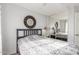 Comfortable bedroom featuring a bed, mirror, ceiling fan, and a window with decorative curtains at 28071 N Superior Rd, San Tan Valley, AZ 85143