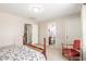 Spacious bedroom includes furniture and two entryways to an attached bathroom and closet at 28071 N Superior Rd, San Tan Valley, AZ 85143