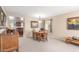 Well-lit dining room with wooden furniture and view into the kitchen at 28071 N Superior Rd, San Tan Valley, AZ 85143