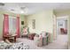 Comfortable living room with ample natural light and seating, with ceiling fan, and doorway at 28071 N Superior Rd, San Tan Valley, AZ 85143