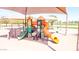Colorful playground with slides, climbing walls, and overhead shade for outdoor recreation at 28071 N Superior Rd, San Tan Valley, AZ 85143