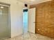 Neutral toned room with red brick accent wall, neutral paint, and tile flooring at 3022 N 32Nd St # 40, Phoenix, AZ 85018