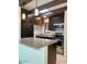The kitchen boasts modern stainless appliances, dark cabinets, granite counters and pendant lighting at 3022 N 32Nd St # 40, Phoenix, AZ 85018