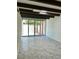Bright living room with exposed beams, white brick walls and sliding glass doors to the outside at 3022 N 32Nd St # 40, Phoenix, AZ 85018