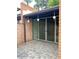 Cozy outdoor brick patio with mature landscaping at 3022 N 32Nd St # 40, Phoenix, AZ 85018