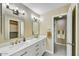 Bathroom features double sinks, modern lighting, and tile flooring at 3154 E Clarendon Ave, Phoenix, AZ 85016