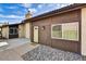 A lovely home with a stone garden and an inviting entrance with a yellow door at 3154 E Clarendon Ave, Phoenix, AZ 85016