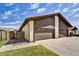 A lovely two-story home showing a two car garage with a beautiful blue sky above at 3154 E Clarendon Ave, Phoenix, AZ 85016