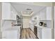 Modern kitchen with white cabinets, stainless steel appliances, and stylish countertops and flooring at 3154 E Clarendon Ave, Phoenix, AZ 85016