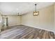 Spacious living room features modern lighting, new flooring, and neutral walls at 3154 E Clarendon Ave, Phoenix, AZ 85016