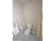 Neutral colored bathroom with a white toilet, matching floor tiles, and minimalist accessories at 3154 E Clarendon Ave, Phoenix, AZ 85016