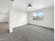 Bright bedroom with a large window and neutral carpet and walls at 32341 N Union St, San Tan Valley, AZ 85143