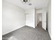 Clean bedroom with neutral carpet and white walls, with closet and entry doors at 32341 N Union St, San Tan Valley, AZ 85143