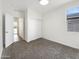 Bright bedroom features a closet with sliding doors and neutral carpeting at 32341 N Union St, San Tan Valley, AZ 85143