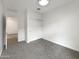 Spacious bedroom with neutral carpet, white walls, and a closet with sliding doors at 32341 N Union St, San Tan Valley, AZ 85143